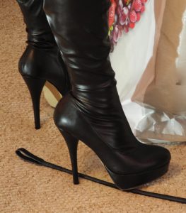 picture of kinky black boots on a crop